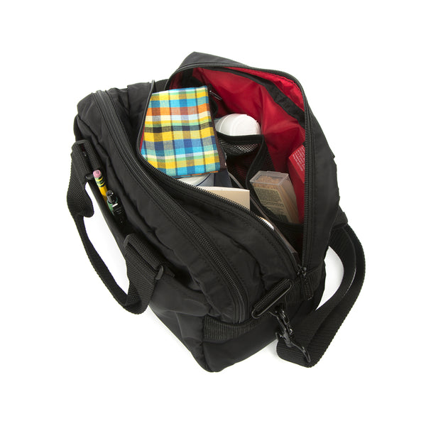 Black backpack with items inside on a white background
